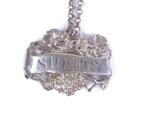 A George III cast silver sherry decanter label, pierced grapevine decoration with belcher link chain, by George Knight, hallm