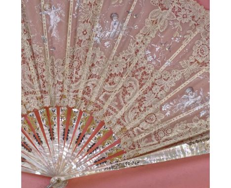 A hand painted lace fan, with carved mother of pearl and ivory sticks, in frame, frame width 76cm.The fan is in frame with no