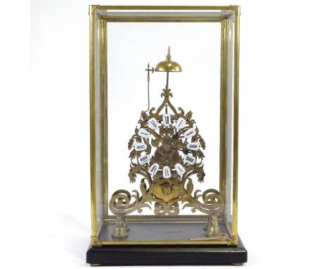 A brass skeleton clock, with enamel numerals and chain driven single fusee movement, in glazed brass display case, case heigh
