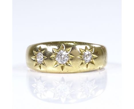 An early 20th century 18ct gold 3-stone diamond gypsy ring, total diamond content approx 0.2ct, setting height 7.5mm, size O,