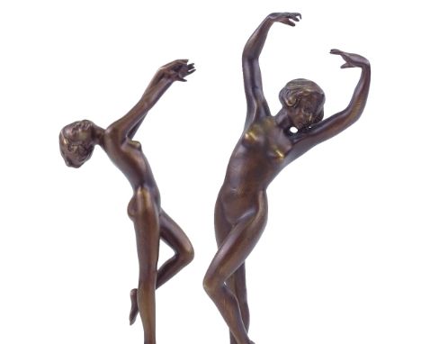 A pair of Art Deco style patinated bronze naked dancing girls, on coloured marble plinth bases, unsigned, height 25cm, mid to