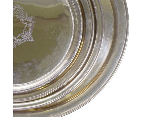 4 silver plated circular tea trays, largest diameter 54cm (4)Lot sold as seen unless specific item(s) are requested 