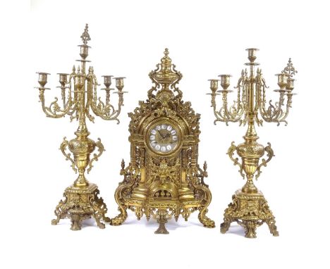 An impressive reproduction cast gilt-brass cased 3-piece clock garniture in Louis XVI style, with enamel numerals and 8-day m