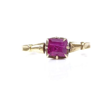 An early 20th century unmarked gold square-cut ruby dress ring, setting height 5.4mm, size L, 1.3gGood overall condition, rub