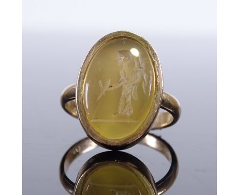 A 14ct gold yellow agate carved intaglio seal ring depicting figure, setting height 18.7mm, size M/N, 5.7gGood overall condit
