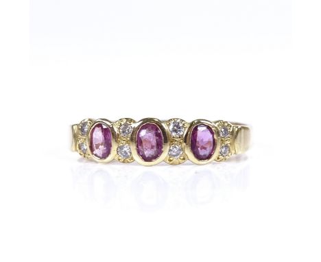 An 18ct gold ruby and diamond half hoop ring, setting height 5.2mm, size U, 3.1gGood overall condition, no obvious damage or 
