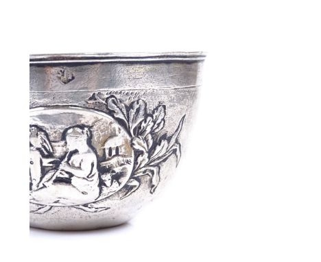 An early 18th century German unmarked parcel gilt silver tumbler cup, relief embossed maiden playing instrument decoration, i