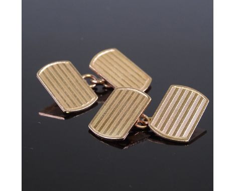 A pair of 10ct rose gold curved rectangular panel cufflinks, engine turned decoration, panel length 16.2mm, 7.3gGood original