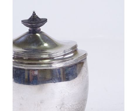 A George V silver boat-shaped tea caddy, bulbous form with reeded edge and turned wood knop, by Thomas Bradbury & Sons, hallm