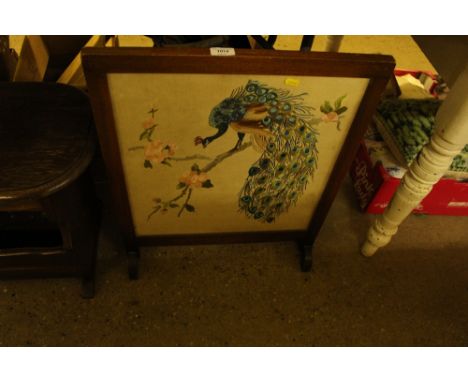 A mahogany framed and silk work firescreen