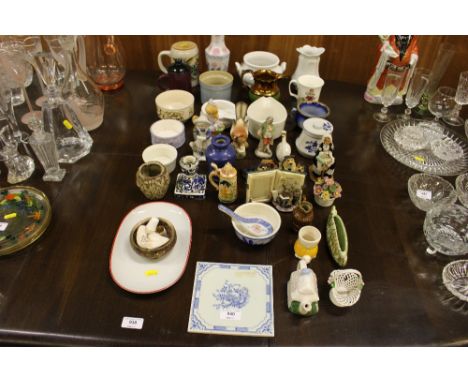 A collection of ornaments; a copper lustre jug; a blue and white tile etc.
