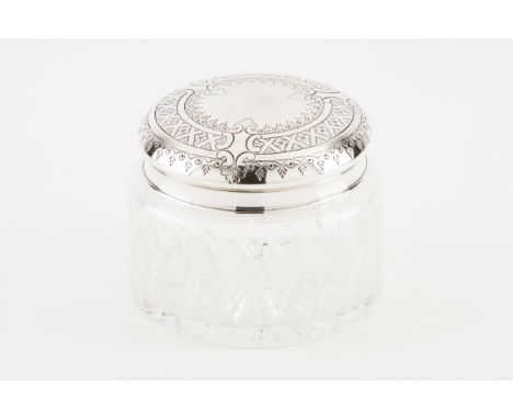 A large toilette flask  Cut crystal, silver cover decorated in relief with flowers and cartouches Porto assay mark (after 198