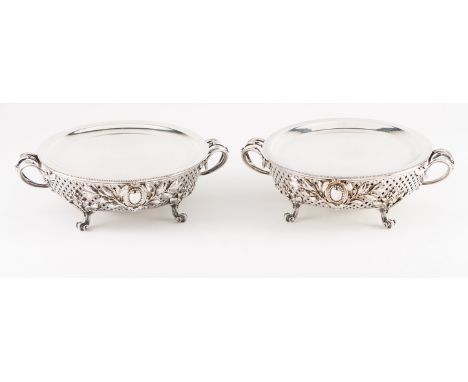 A pair of plate warmers, CHRISTOFLE  Silvered metal, chased and pierced decoration in the Louis XVI manner, interior with lam