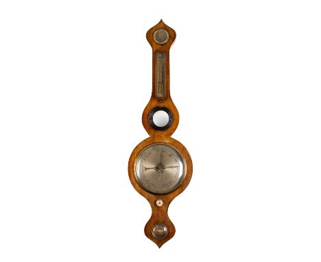 An oak five-dial wheel barometer the eight-inch silvered dial with usual barometer markings, the oak onion-top case set with 