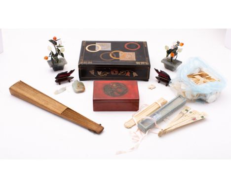 A mixed group of Oriental works of art comprising a small carved jade snuff bottle [devoid stopper, a jade carp pendant,, two