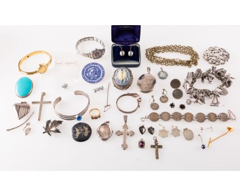 A mixed collection of silver and costume jewellery, silver jewellery including a charm bracelet with various charms, bracelet