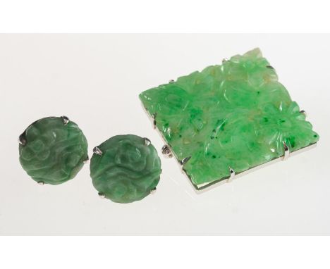 Two items of carved jade jewellery, including a square shaped brooch, the jade carved in a pierced floral design, marked 9ct,