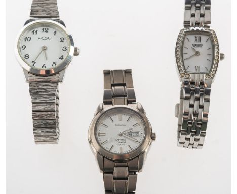 A group of three dress watches,  including a Seiko Sapphire Titanium 100m with day and date window; a Citizen quartz watch wi