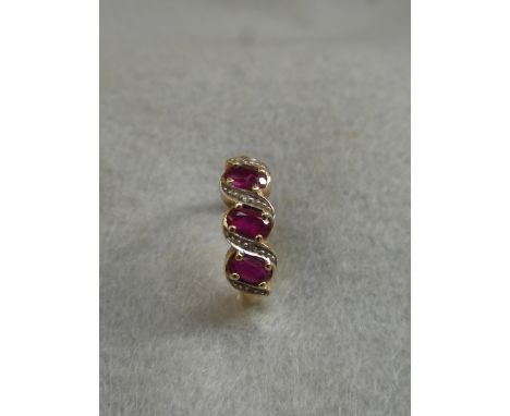 A 9ct gold ruby and diamond dress ring, size L.