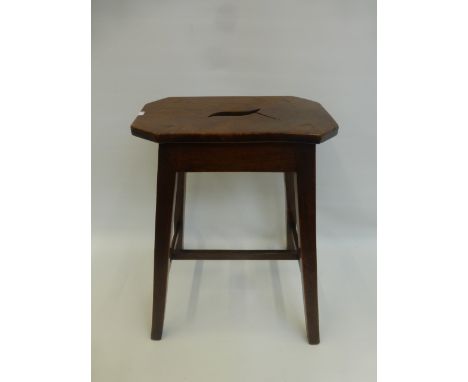 A Georgian figured elm country stool with cut out handle and splayed square supports.