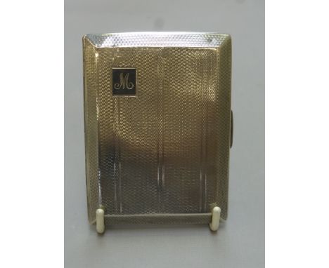 An Art Deco silver cigarette case with engine turned decoration, maker - Smith and Bartlem, Birmingham, 1935.