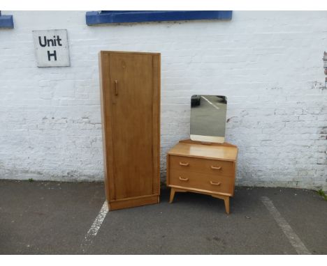 A G Plan light oak wardrobe and matching dressing table with swing mirror above two drawers, in the manner of Heals.