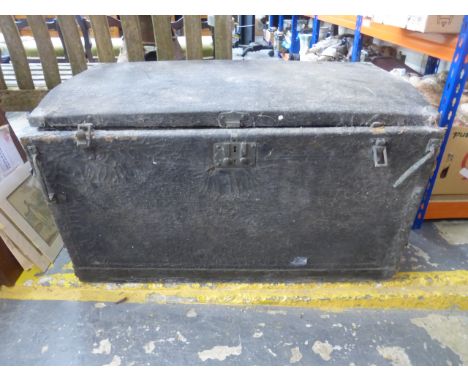 A large vintage car travel trunk with curved back.
