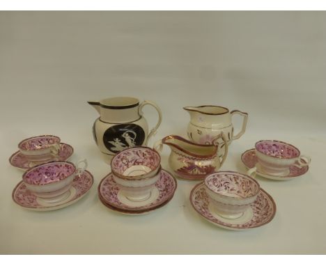 A 19th Century creamware relief moulded water jug, a Sunderland lustre sauce boat and six pink lustreware cups and saucers.