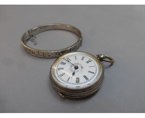 A continental silver pocket watch and a silver bangle with safety chain.