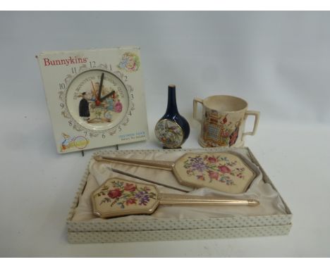 A Royal Doulton Bunnykins clock, a Queen Victoria commemorative mug and a Carltonware bud vase.