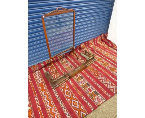 A room size rug weaved on a loom with multiple orange and red horizontal and herring-bone lines, also an oak extending fender