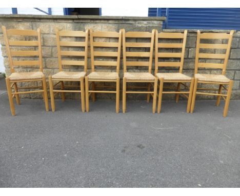 A set of six Heals style rush seated ladder back dining chairs.
