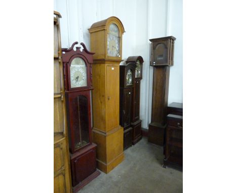 Three mahogany dwarf longcase clocks, an oak longcase clock and an oak longcase clock case 