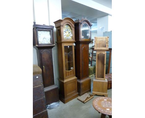 Two oak longcase clocks, an oak longcase clock case and a pine longcase clock case 
