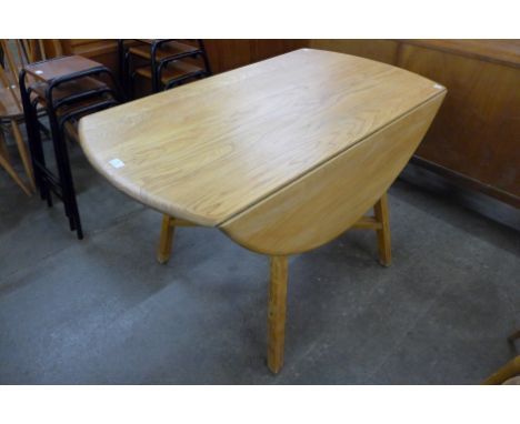 An Ercol Blonde elm and beech drop-leaf table 