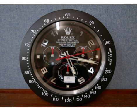 A Rolex style dealer's display wall clock 