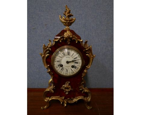 An early 20th Century French faux tortoiseshell and gilt metal mounted mantel clock 