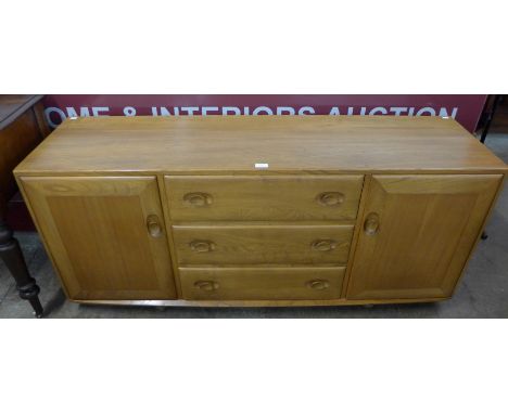 An Ercol Blonde elm and beech Windsor sideboard 