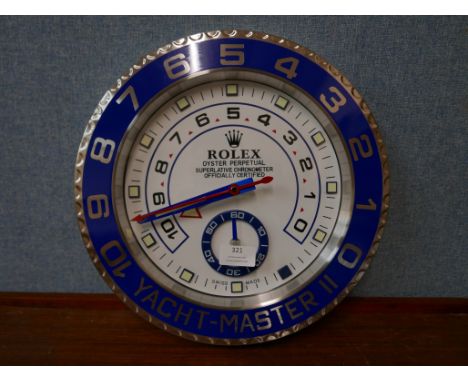 A Rolex style dealer's display wall clock 