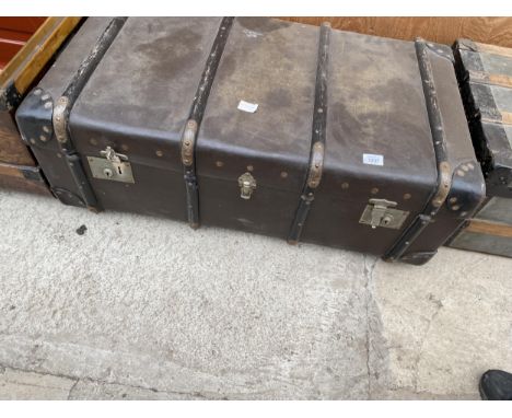 A VINTAGE WOODEN BANDED TRAVEL TRUNK 