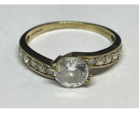 A 9 CARAT GOLD RING WITH A CENTRE CUBIC ZIRCONIA AND TEN ON THE SHOUDLERS SIZE N/O 