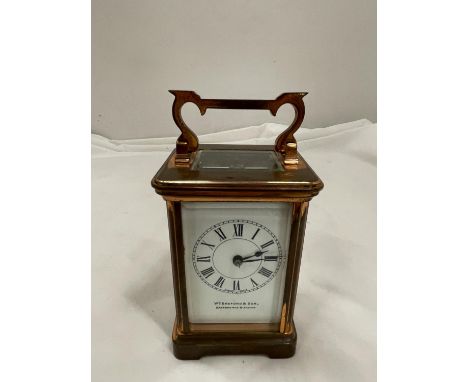 A COPPER CARRIAGE CLOCK WITH BRASS MOVEMENT BY Wm BUFORD AND SON EASTBOURNE AND EXETER WITH TOP ESCAPEMENT VEIWING PANE 