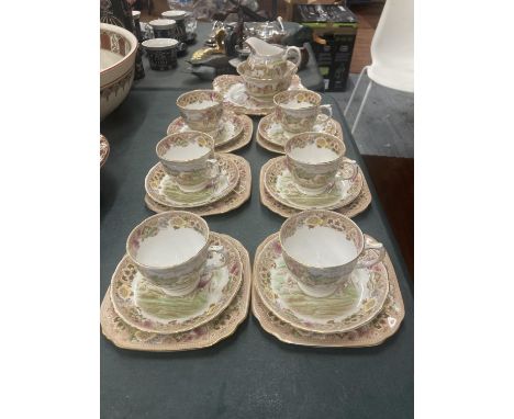 A TUSCAN TEASET WITH A COACHING SCENE DESIGN TO INCLUDE A CAKE PLATE, CREAM JUG, SUGAR BOWL, CUPS, SAUCERS AND SIDE PLATES 