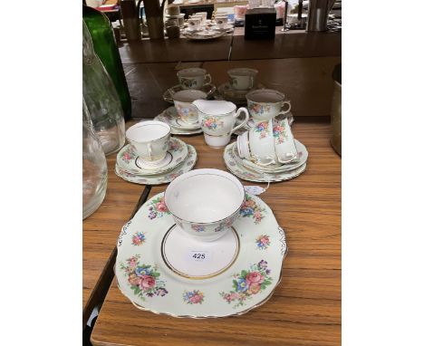 A COLCLOUGH TEASET IN A PALE GREEN FLORAL PATTERN TO INCLUDE A CAKE PLATE, CREAM JUG, SUGAR BOWL CUPS, SAUCERS AND SIDE PLATE