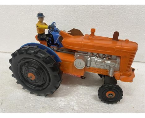 A BATTERY POWERED PLASTIC MODEL OF A VINTAGE TRACTOR 