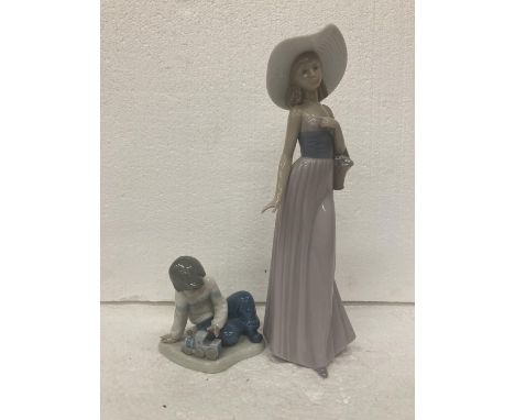 A TALL NAO FIGURINE OF A LADY CARRYING A BASKET OF FLOWERS 535 - 32 CM AND A NAO FIGURE OF A BOY WITH TRAIN 11 CM 