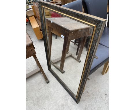 A MODERN GILT FRAMED WALL MIRROR, 40" X 28" 