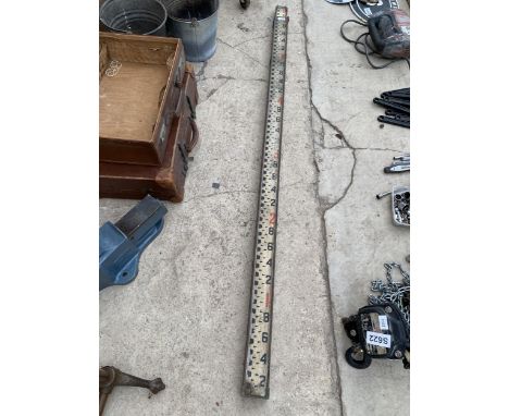 A VINTAGE WOODEN SURVEYORS STAFF 