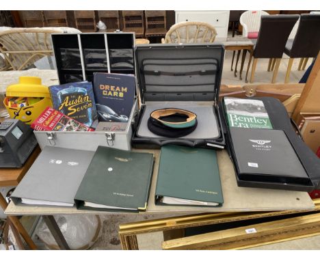 AN ASSORTMENT OF CAR ITEMS TO INCLUDE ASTON MARTIN MANUALS, BENTLEY BOOKS, A SAMSONITE BRIEFCASE AND A 'HOBSON &amp; SON' CON