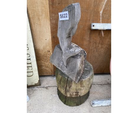 A WOODEN CARVED FISH WITH LOG RING PEDESTAL BASE 